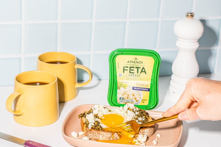Athenos Feta Pesto Eggs

Active time: 10 minutes 
Total Time: 20 minutes
Serves 4

Description: If you love simple, flavorful, savory breakfasts this recipe is IT. Pesto and feta cheese crumbles are a flavor match made in heaven all topped on a crispy piece of your favorite toast. 

Ingredients: 
 
2 tbsp pesto
2 eggs
Kosher salt
Cracked black pepper
2 slices bread (cooks choice), toasted 
2 oz Athenos feta cheese crumbles 


Method: 

Heat a small non-stick fry pan over medium-low heat. Add in pesto and spread into a thin layer. 
Crack two eggs into the pan over the pesto and cook for 3-4 minutes or until the whites have set and yolk is cooked to preference. 
Toast slices of bread and top eggs with feta cheese before serving.